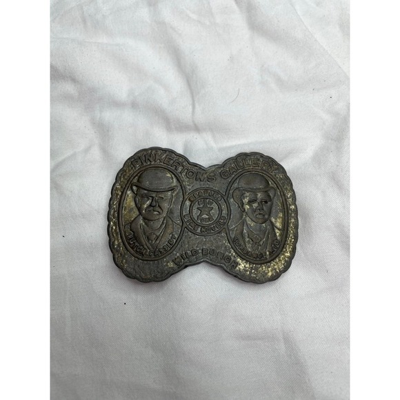 vintage belt buckle featuring "Pinkerton's Gallery" with images of Butch